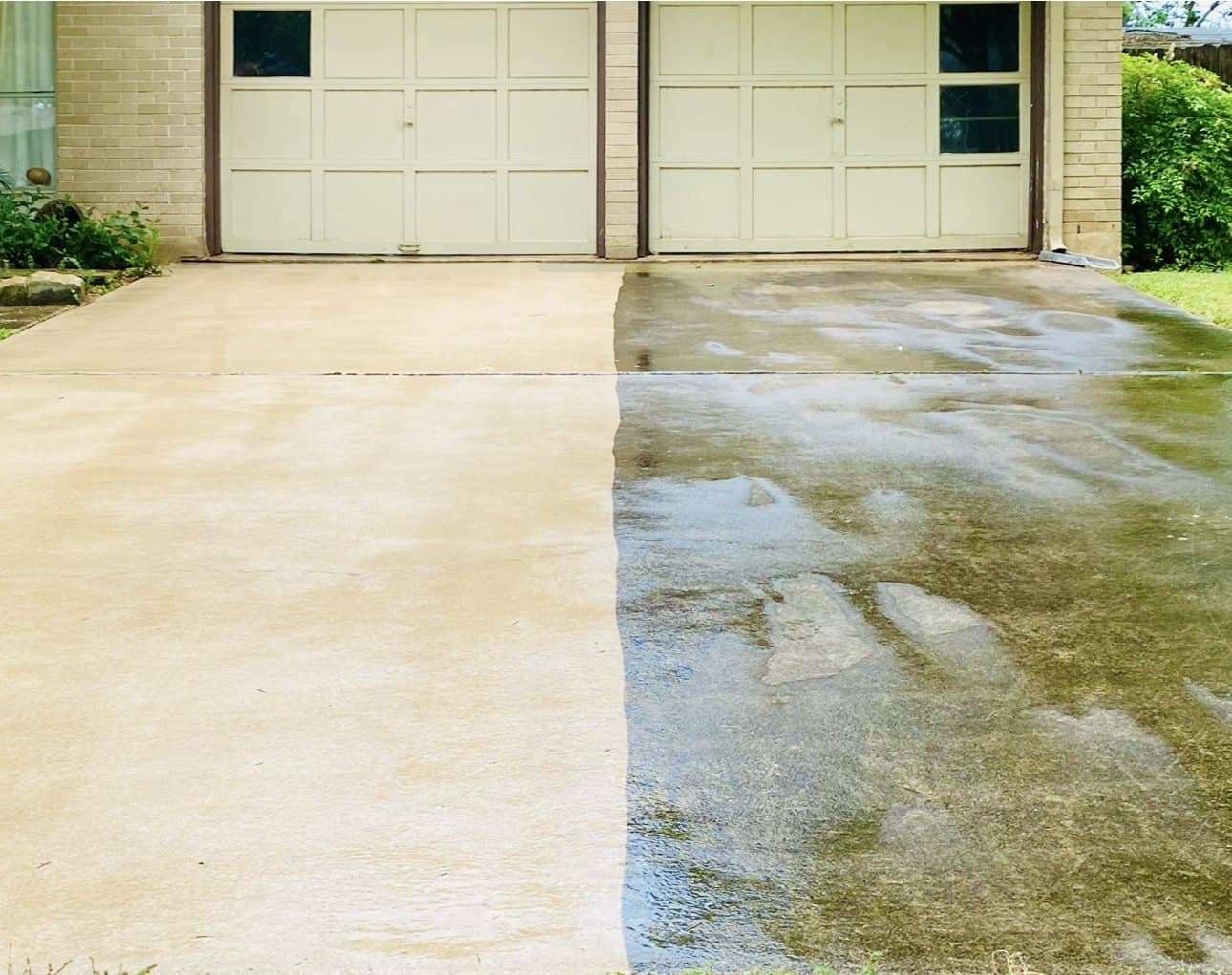 Driveway half cleaned, showing the difference on the same slab