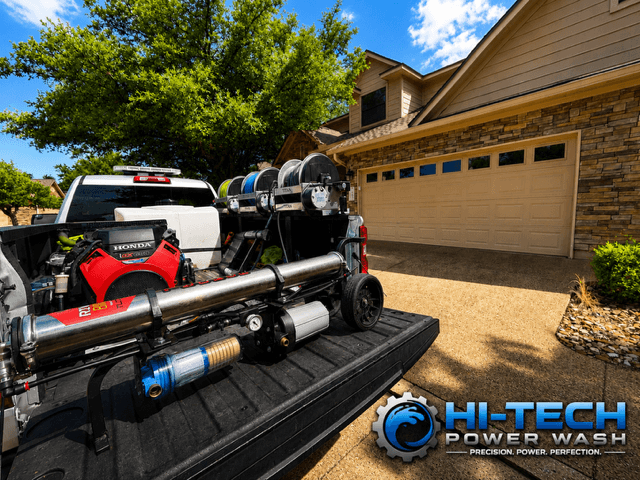 Hi-Tech Power Wash truck-mounted equipment set up on a residential driveway in Austin, TX