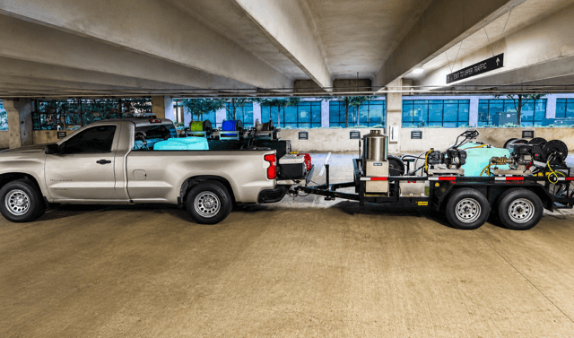 Hi-Tech Power Wash truck and trailer-mounted pressure washing equipment on a commercial job in Austin, TX